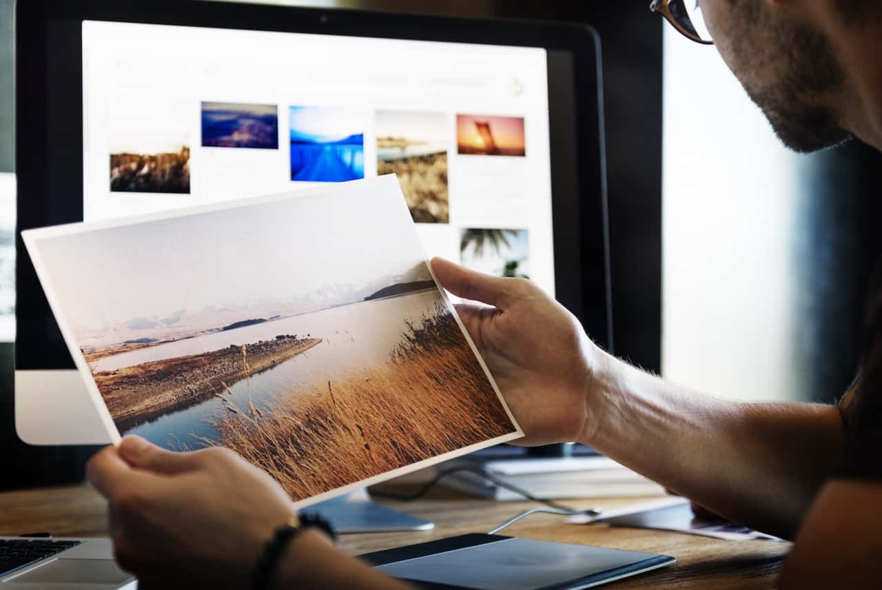 Man looking at a photograph